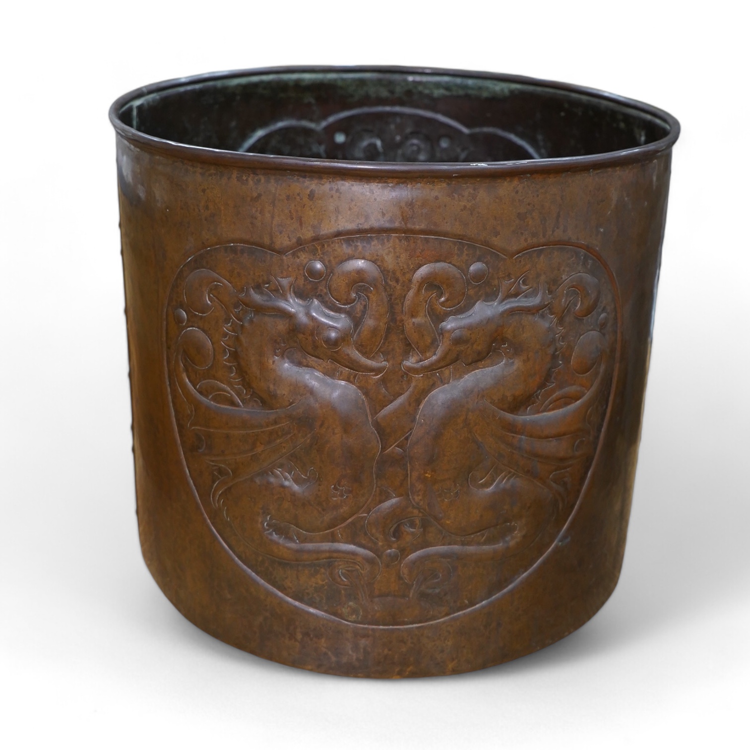A large Arts and Crafts embossed copper jardiniere decorated with seahorses, stamped Newlyn to base, 28cm high, 33cm in diameter. Condition - good
